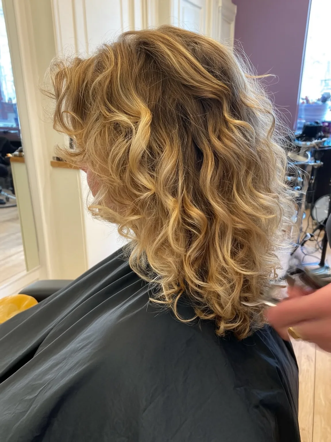 Golden Blonde Curly Layered Cut for Round Faces